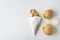 top view of french fries in paper cone, two hamburgers and mayonnaise,