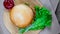 Top view of fresh appetizing hamburger rotating on wooden plate