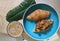 Top view of fresh butter croissants in blue plate serving with americano coffee.