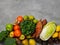 Top view of fresh raw vegetables, fruits on gray background banner. Different varieties of cabbages, chinese cabbage, broccoli,