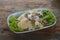 Top view fresh stir fried mixed vegetables in a blue plate, placed on a wooden floor background, food, nature, copy space