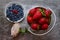 Top view of fresh strawberries and honeysuckle