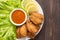 Top view fried chicken wings on wooden background