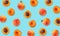 Top view of fruit pattern of ripe apricots on blue background