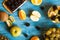 Top view of fruits and barries over a blue desk in studio