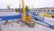 Top view of the gantry crane on the transport site. Clip. Various brands and colours of Shipping containers stacked by