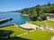 A top view on the garden of Miramare caste at the seaside of Adriatic sea. A beautiful garden with high trees and green grass is