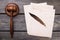 Top view gavel with quill and papers.