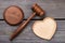 Top view gavel with wooden heart shape.