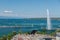 The top view of Geneva with the famous fountain and old buildings with tiled roofs, Switzerland