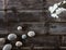 Top view of genuine wood background with pebbles and orchids