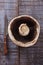 Top view of giant mushroom over rustic wooden background