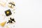 Top view of gift boxes and party accessories in various black, white and golden designs. Flat lay, copy space. A concept of