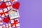 Top view of gift boxes, wooden calendar and red textile hearts on colorful background. The fourteenth of february. St Valentine`s