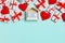 Top view of gift boxes, wooden calendar and red textile hearts on colorful background. The fourteenth of february. St Valentine`s