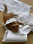 Top view of a Ginger Kitten, mixed-breed cat, playing with soft paper