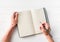 Top view of girl creating a plan in notebook