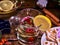 Top view of glass mug and Christmas plate cookies.