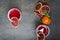 Top view of glasses of blood orange margarite, mint, slices of fruit