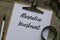 Top view of glasses,magnifying glass,pen and clipboard with white paper written with Alternative Investment on wooden background