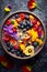 Top view gluten-free rainbow smoothie bowl with edible flowers and superfood toppings