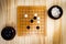 Top view Go Game board Goban, Baduk or Weiqi-Chinese Board Game Background