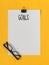 Top view goals list with notebook, glasses on yellow background