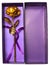 Top view gold rose in purple prensent box