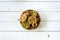 Top view granola bar in bowl on wood table background.