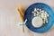 Top view of greek cheese and bulgarian cheese on wooden table over wooden textured background. Symbols of jewish holiday - Shavuot