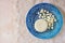 Top view of greek cheese and bulgarian cheese on wooden table over wooden textured background. Symbols of jewish holiday - Shavuot