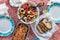 Top view of a Greek lunch meal at summer with omellete, horiatiki salad, feta cheese and bread