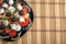 Top view of the Greek vegetarian salad in a black plate