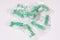 Top View Green Disposable Prophy Angles with Brush, Ergonomic Shape on White Background