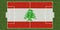 Top view of Green grass soccer field with flag of Lebanon. football background. 3d illustration