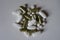 Top view of green moringa capsules, white calcium caplets and vitamin K tablets