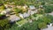 Top view green neighborhood near Dallas, Texas, USA surrounding by matured trees with a landscaping truck cut down tree