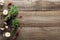 Top view of green thyme, dried chili peppers, garlic cloves and black pepper on wooden weathered table with copy space.