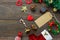 Top view greeting card with Christmas decoration on wooden table