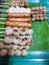 Top view of grilled pork balls skewers and sausage on banana leaf as a background