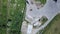 Top view of ground, building area, containers and white metallic construction