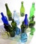 Top view of a group of bottles scattered on a white background