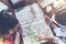 Top view of group of girls with map sitting at desk