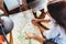 Top view of group of girls with map sitting at desk