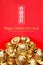 Top view group of golden ingots on red tray at red background.Chinese new year concept,leave space for adding