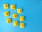 Top view of a group of rubber ducks isolated on a blue background- teamwork concept