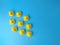 Top view of a group of rubber ducks isolated on a blue background- teamwork concept