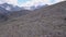 Top view of group of tourists vacationing on mountain route. Clip. Mountaineers line up along mountain rocky path on