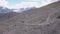 Top view of group of tourists vacationing on mountain route. Clip. Mountaineers line up along mountain rocky path on