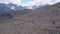 Top view of group of tourists vacationing on mountain route. Clip. Mountaineers line up along mountain rocky path on